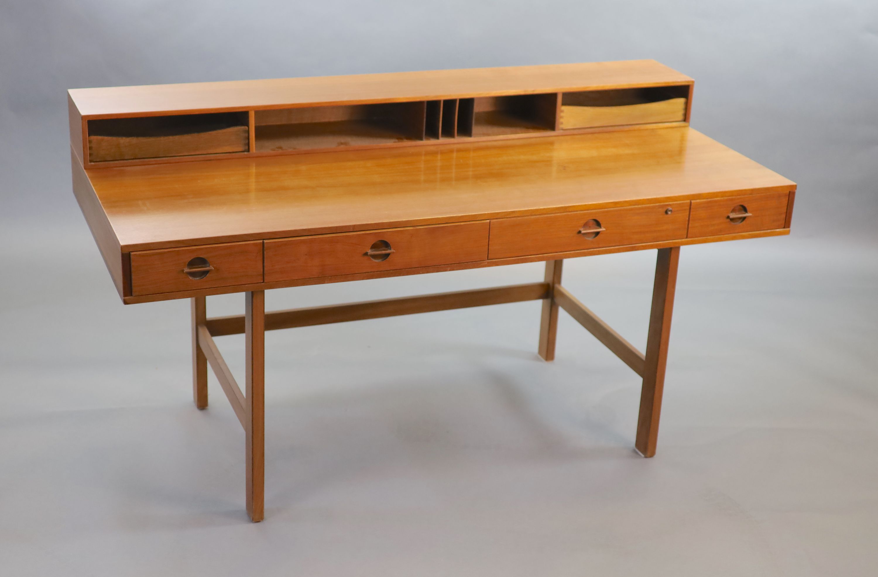 Jens Quistgaaard for Lovig, a Danish teak flip top desk circa 1973, W. 162. H. 86. D. 73 cm.